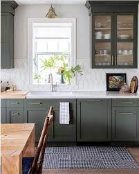 You don't have to opt for a super bright paint if you want a green kitchen, and softer tones such as the one in this design can look absolutely gorgeous. Something About Deep Green Kitchens Bring Summer Feels Is That Just Us Photo Pineconecamp Via Fr Dark Green Kitchen Green Kitchen Cabinets Kitchen Design