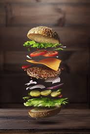 Classic Burger Ingredients Flying On A Wooden Brown Background Ide Makanan Makanan Dan Minuman Resep Makanan