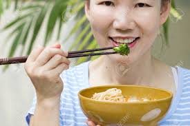 Woman Hand Holding A Bowl Of Noodles Stock Photo, Picture and Royalty Free  Image. Image 67662679.