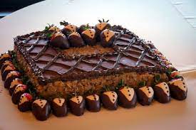 Simple And Classy German Chocolate Grooms Cake With Yummy Tuxedo Strawberries Chocolate Grooms Cake Grooms Cake German Chocolate Cake Mix