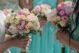 We did not find results for: Decorative Beautiful Fresh Wedding Bouquets Of Colorful Rose Flowers Pink Violet Lilac Purple White Orange And Yellow In Hands Of Bride And Bridesmaid In Blue Dresses Horizontal Picutre Stock Photo Picture And