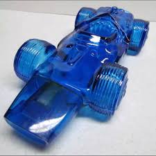 Looking for a good deal on glass race? Vintage Avon Blue Glass Race Car Bottle Decanter Depop