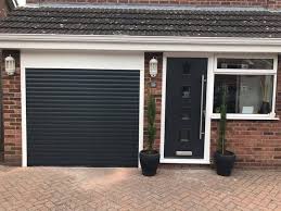 This home exterior has cedar shake siding in sherwin williams 2851 sage green light stain color with cedar trim and natural stone accents. Pin On Garage Door Inspo