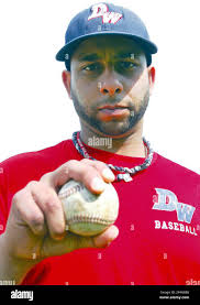 In this April 22, 2014 photo, former U.S. Marine, Ariel Ramos, poses with a  baseball. After serving an eight-month tour of duty as a Marine in  Afghanistan, even the roughest of outings
