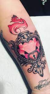 The heart locket tattoo is a beautiful theme. 25 Heart Locket Tattoos Ideas Designs Meaning Tattoo Me Now
