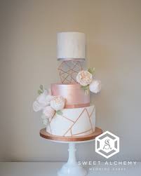 Modern Copper And Rose Gold Wedding Cake With Copper Geometric Pattern Light Marble Swirl Rose Gold Rose Gold Wedding Cakes Gold Wedding Cake Geometric Cake