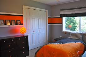 Black And Orange Dresser The Walls Are A Medium Grey With A Large Orange Stripe Surrounded By Smaller Black And White Stripes The Dresser Was W Bunk Beds Built In New Room Walls Room