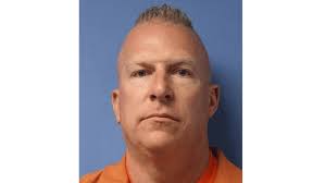 School administrator accused of menacing driver with gun pleads not guilty