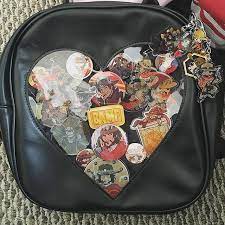 update on my mccree itabag it s getting kinda heavy and hard to hold up the charms mccree jessemccree overwatch itabag purses and bags artsy bag bags