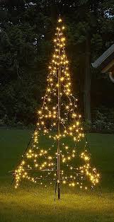 Will You Fake It This Year Artificial Christmas Trees Have Never Been So Chic Outdoor Christmas Tree Outdoor Christmas Lights Outdoor Christmas Diy