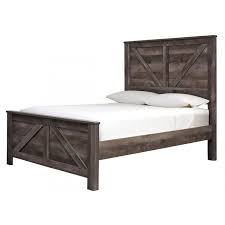 The wynnlow queen panel bed is sure to win your heart with its daring designer take on modern rustic. Wynnlow Crossbuck Panel Bed By Signature Design By Ashley Furniturepick
