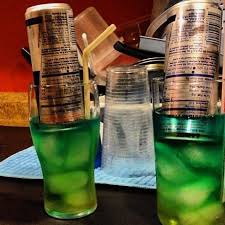 Pour the blue curaçao in the long drink glass. Tipsy Bartender