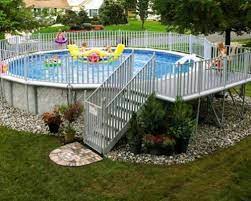 A freestanding above ground pool can stick out like a sore thumb in the middle of your backyard if you don't find a way to integrate it into the landscape. 12 Above Ground Swimming Pool Designs Above Ground Pool Landscaping Above Ground Swimming Pools Pool Landscape Design