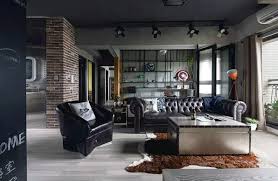 A dark living room with black walls, upholstered and leather furniture, metal lamps, masculine decorating living room ideas. 100 Bachelor Pad Living Room Ideas For Men Masculine Designs