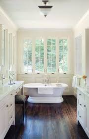 Many are opting for using the same white marble tile throughout the bathroom, but mixing up the shapes on the floors, walls and shower area. September 2008 Wood Floor Bathroom House Design Bathrooms Remodel
