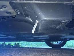 Metal bar hanging under car. What Should I Do About Metal Strip Sticking Out From Under Car Motor Vehicle Maintenance Repair Stack Exchange