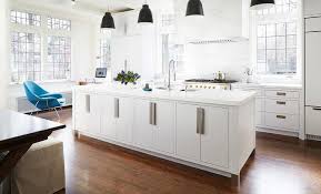 White Center Island With Black Industrial Pendant Lights Modern Kitchen