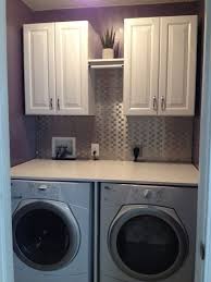Laundry Room Finished Product Cabinets Hanging Rod Folding Table And Backsplash Laundry Room Ha Laundry Room Remodel Small Laundry Laundry Room Cabinets