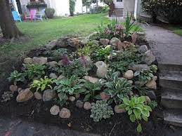 The plant needs water to survive, while water can run off the slope. Chuck Does Art Landscaping Shady Hillside Rock Garden Landscaping Landscaping With Rocks Sloped Backyard Landscaping