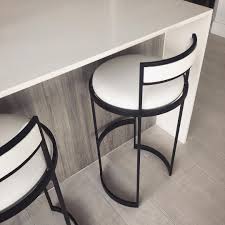 Chic Monochrome Swivel Stools Sitting Pretty At The Kitchen Island Of Our Biscayne B Modern Furniture Living Room Bar Stool Furniture Bar Stools Kitchen Island