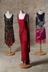 Paul Poiret The First Dress On The Left Is Entirely Embroidered With White Glass Tubules Flowers And Shades Of Grey Ri 1920s Fashion Vintage Dresses Fashion