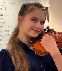 Karolina plays with puppet like a little girl, but look at her crafty face!