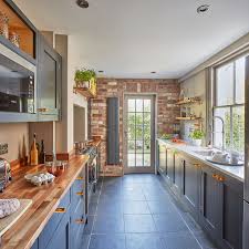 dark blue units and walnut worktops