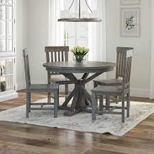 This charming table suits a variety of styles while adding warm, earthy tones with its tabacco brown finish. Alamosa Solid Teak Wood Grey Round Dining Table Chair Set