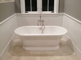 Beadboard is a style of wood paneling that features decorative beading (or distinctive thin molding) between vertical panels of wood. Tub Surrounded By Beadboard Wainscoting Windsorone