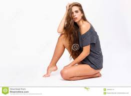 A Girl in Panties Sits Sideways on One Knee Against a White Background  Stock Photo - Image of elegant, naked: 104542114