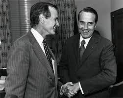 George H.W. Bush laughing with Bob Dole ...