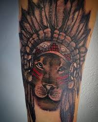 You are regal and powerful, and a lion tattoo can convey this meaning forcefully and with grace. Lion Liontattoo Lionhead Lion Liontattoo Liontattoos Liontattoodesign Indian Feather Tattoos Headdress Tattoo Native Tattoos