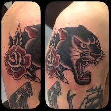 Black And Grey Traditional Panther Head By Chris Lambert Done At Snake And Tiger Tattoo Leeds Traditional Tattoo Traditional Rose Tattoos Traditional Panther