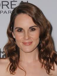 Michelle Dockery attends the "Downtown Abbey: The Grand Finale" world  premiere 🩵 The actress debuted her growing baby bump