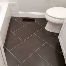 Ceramic tile is one of the best types of flooring you can install in a bathroom. 12x24 Tile Bathroom Floor Could Use Same Tile But Different Design On Shower Walls Not This Ex Small Bathroom Tiles Modern Small Bathrooms Small Bathroom Diy