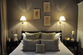 This modern bedroom uses recessed lighting within the ceiling to create more space and light. Bedroom Wall Sconces Lighting Ideas For Decoration Sconce Placement Mount Lights Light Brown Walls Master Antique Reading Traditional Edison Apppie Org
