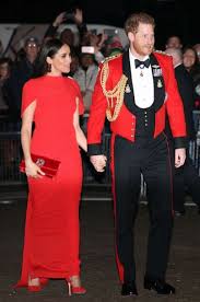 The queen wears five poppies as she is joined by kate and william for the festival of remembrance at royal albert hall (but who put harry and meghan in the cheap seats?) theresa may will also attended after laying wreaths and reciting a poem yesterday in france and. Prince Harry Duchess Meghan Dazzle In Red At Concert One Of Their Last Engagements As Senior Royals Gma