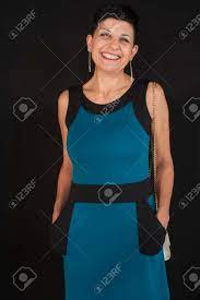 A Beautiful Middle-aged Woman With A Smile. Milf Standing With Black  Background Stock Photo, Picture and Royalty Free Image. Image 91216215.