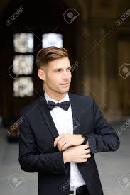 See more of wearing black on facebook. Young Man Standing And Posing Wearing Black Suit And Bow Tie Stock Photo Picture And Royalty Free Image Image 144118998