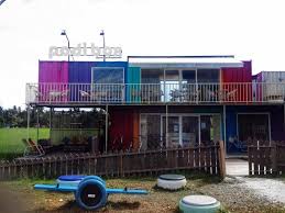 A homestay made of a bunch of colorful shipping containers stack on each other around a central courtyard: Padi Box Homestay Sekinchan The Coolest Container Hotel In The Middle Of Paddy Fields Lamyerda