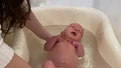 4.now it's time for his tummy, go around the umbilical cord, making sure it does not get wet. Baby Boy Take A Bath In Soft Bathtub Wit Stock Video Pond5