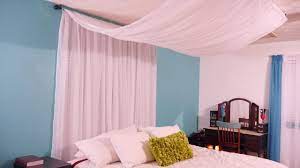 Use a thick patterned fabric to make a canopy that doubles as a headboard. Diy Canopy Easy Inexpensive Youtube