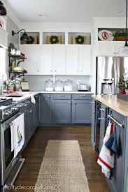 27 Beautiful Christmas Kitchen Decor Ideas And Makeover In 2020 Above Kitchen Cabinets Cabinets To Ceiling Upper Kitchen Cabinets