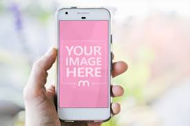 Download Mockup Generator Template Featuring A Person Holding A White Smartphone In Hand On A Blurred Outdoor Background Mockup Generator Photoshop Mockup Free Mockup
