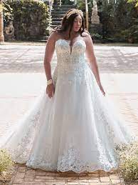 It is crafted from a crisp ivory crepe fabric, and the lace detailing on the sleeves adds a welcome touch of glamour. Finding The Perfect Wedding Dress For Your Body Type