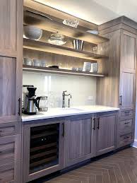 Dark colors provide dramatic contrast to the oak cabinetry. Kitchen Renovation With Grey Stained Oak Cabinets Home Bunch Interior Design Ideas