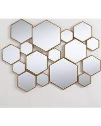 Modern metal wall sculpture composed of two columns of hexagons, several with round mirrored panel inserts. Deals Sales For Mirrors Hexagon Mirror Hexagon Mirror Wall Decor
