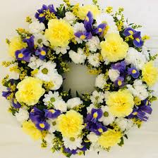 Pink & mauve posy from £30.00. Classic Wreath Yellow Purple Katherine S Florists