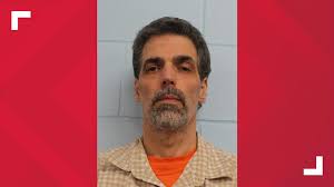 Hudson man arrested after hours-long stand-off charged with killing wife