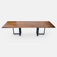 Distressed wood doesn't sound like a great aesthetic choice, but it is quite a fetching addition if you want a rustic theme. Walnut Wood Planks Dining Table Metal Base With Powder Coated Finish Rotsen Furniture